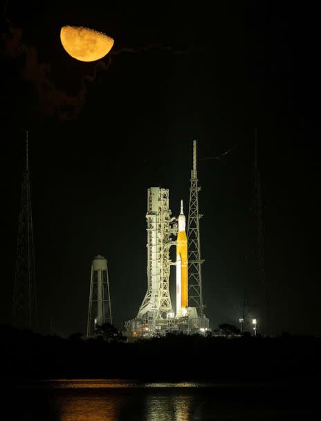 PHOTO: The moon rises above the Space Launch System rocket with the Orion spacecraft aboard  on launch pad 39B as preparations for the Artemis mission continue at the Kennedy Space Center, Nov. 14, 2022, in Cape Canaveral, Fla.  (Bill Ingalls/NASA via Getty Images)