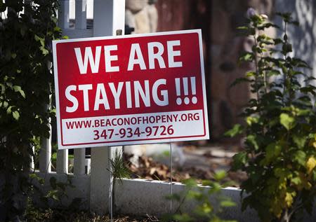 A sign is pictured in front of a house in the New Dorp Beach area in the Staten Island borough of New York, September 20, 2013. REUTERS/Carlo Allegri