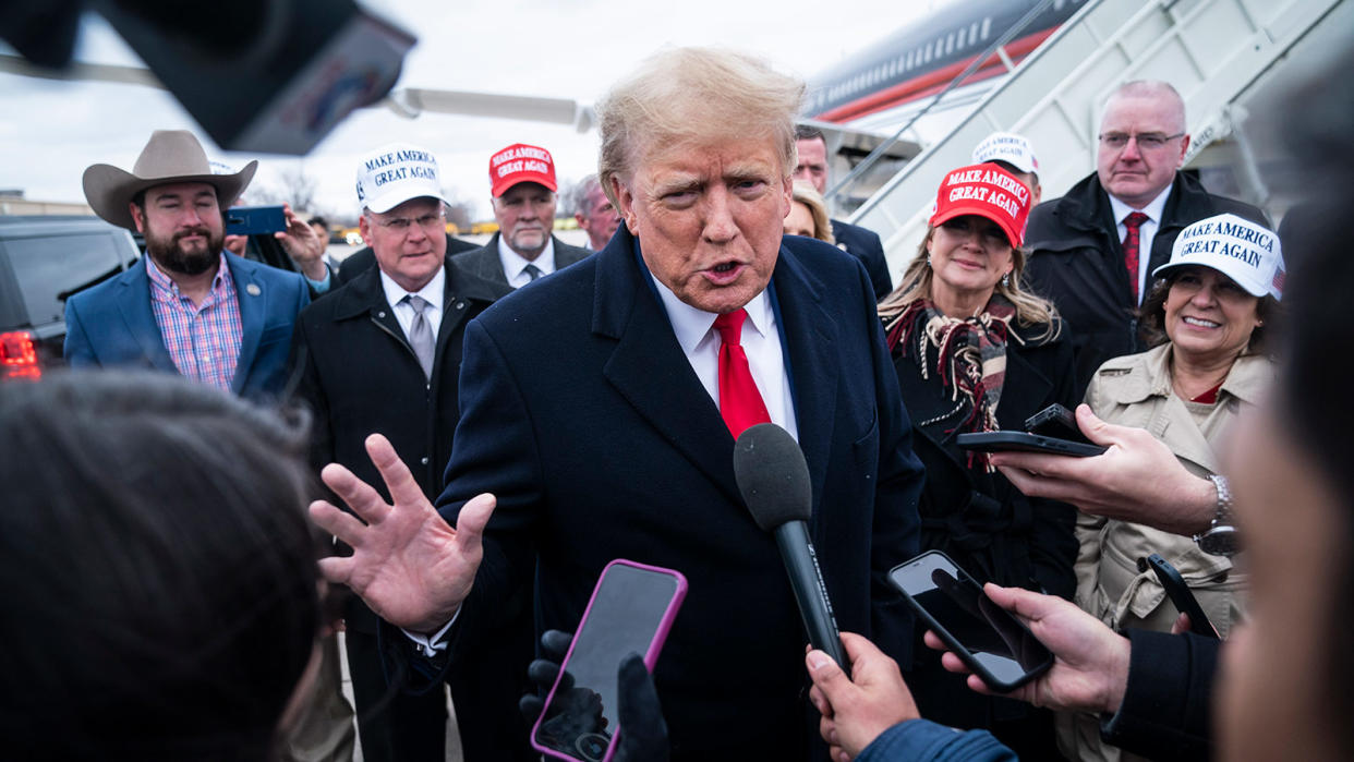 <b>Former President Donald Trump speaks with reporters as he lands at Quad City International Airport en route to Iowa March 13, 2023, in Moline, Illinois. Trump, who is running for the GOP presidential nomination, was indicted on federal charges.</b> Jabin Botsford/The Washington Post via Getty Images