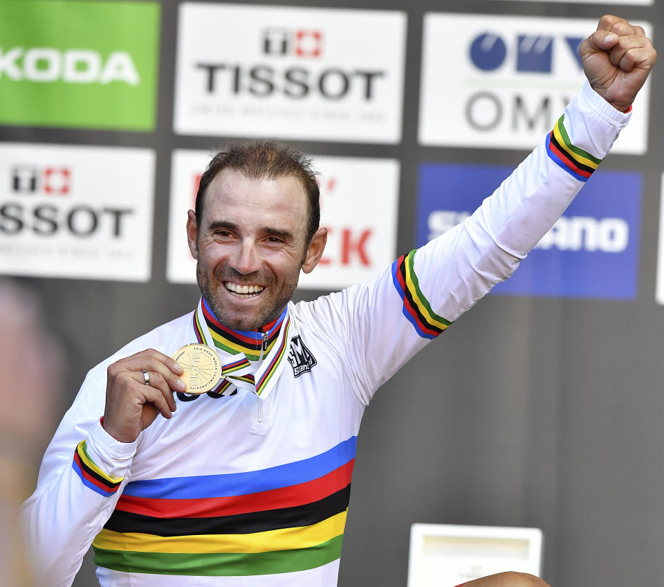 Spain's Alejandro Valverde reacts on the podium after winning the men's road race at the Road Cycling World Championships in Innsbruck, Austria, Sunday, Sept.30, 2018. (AP Photo/Kerstin Joensson)