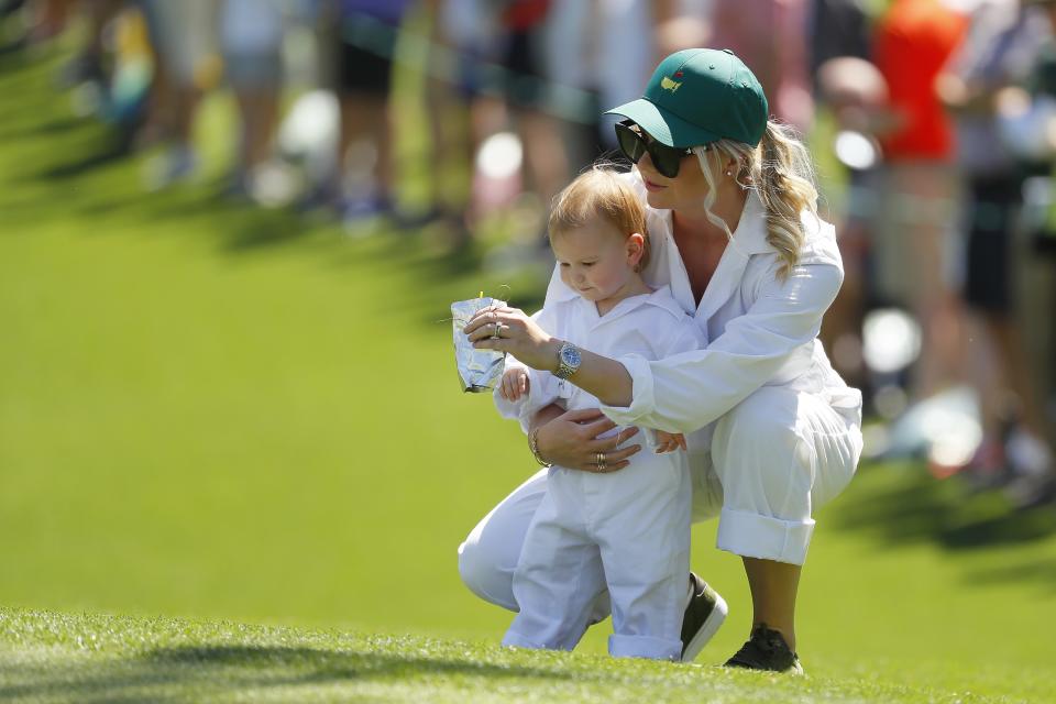 AUGUSTA, GEORGIA - APRIL 10: Henriette Friis, fiancee of Lucas Bjerregaard of Denmark (not pictured), looks on with their daughter Josephine during the Par 3 Contest prior to the Masters at Augusta National Golf Club on April 10, 2019 in Augusta, Georgia. (Photo by Kevin C. Cox/Getty Images)