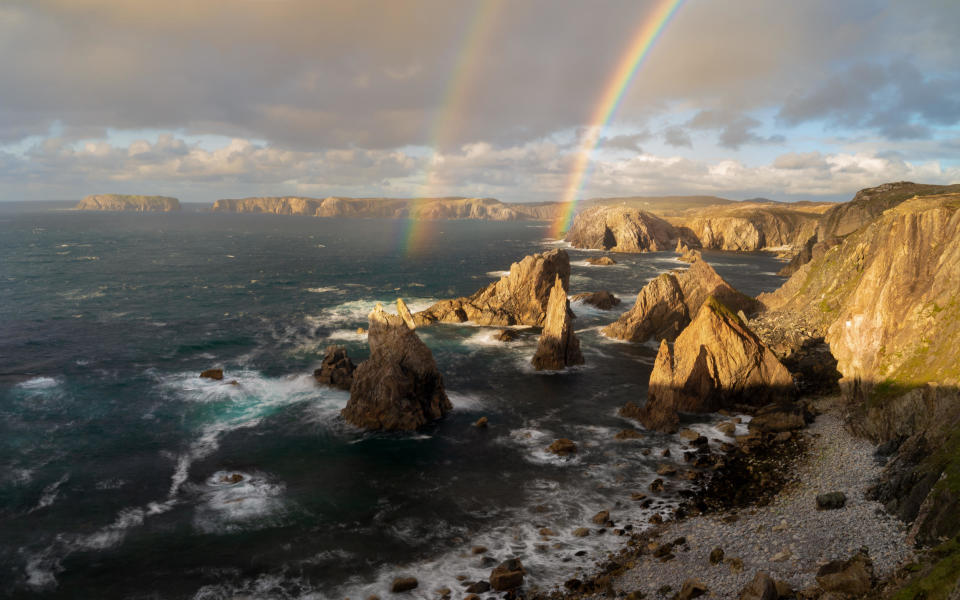 A rainbow over Mangersta sea stacks on the Isle of Lewis, Scotland