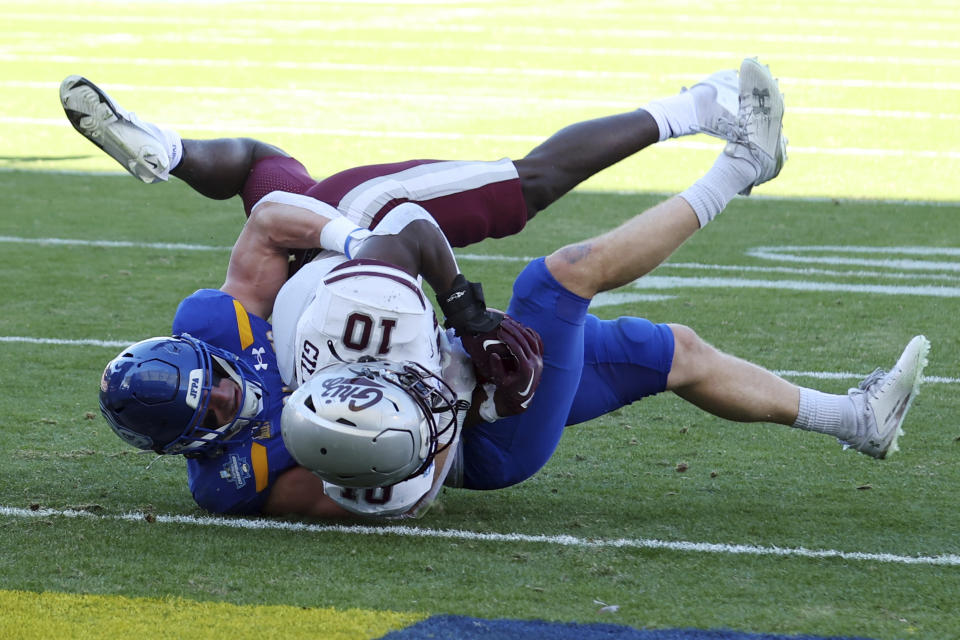 South Dakota State linebacker Adam Bock, left, stops Montana running back Eli Gillman (10) short of a touchdown in the second quarter at the FCS Championship NCAA college football game Sunday, Jan. 7, 2024, in Frisco, Texas. (AP Photo/Richard W. Rodriguez)