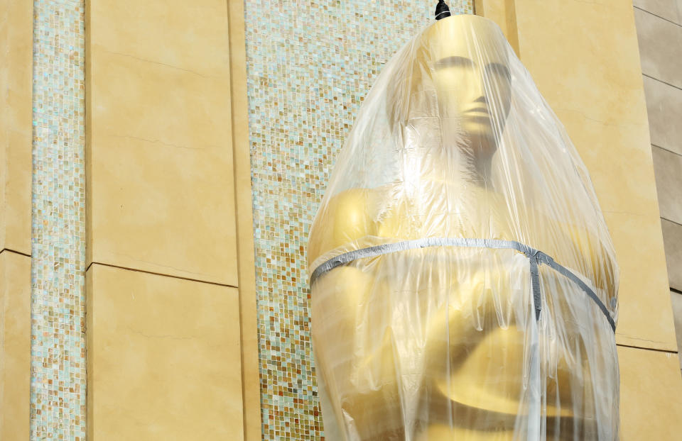 An Oscar statue is covered in plastic as preparations are made for the 86th Academy Awards in Los Angeles, Wednesday, Feb. 26, 2014. The Academy Awards will be held at the Dolby Theatre on Sunday, March 2. (Photo by Matt Sayles/Invision/AP)