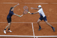 Croatia's Mate Pavic, right, and Brazil's Bruno Soares play a shot against Kevin Krawietz and Andreas Mies of Germany in the men's doubles final match of the French Open tennis tournament at the Roland Garros stadium in Paris, France, Saturday, Oct. 10, 2020. (AP Photo/Michel Euler)