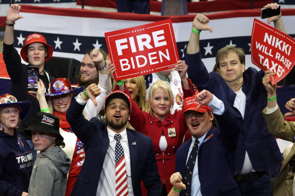 Supporters of Republican presidential candidate and former U.S. President Donald Trump give thumbs down to members of the press during a campaign event at the Winthrop Coliseum on Feb. 23, 2024 in Rock Hill, South Carolina. (Alex Wong/Getty Images)