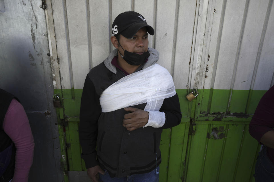 A subway passenger, injured when two subway trains collided, waits to be taken to a hospital, in Mexico City, Saturday, Jan. 7, 2023. Authorities announced at least one person was killed and dozens were injured in the Saturday accident on Line 3 of the capital's subway. (AP Photo/Fernando Llano)