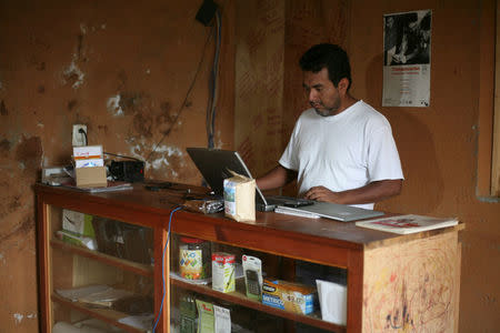 Oswaldo Martinez, director of Fundacion Santa Maria A.C. and coordinator of the community radio station and the community-run phone network, works at his office in Santa Maria Yaviche, in Oaxaca state, Mexico, September 26, 2016. Picture taken September 26, 2016. REUTERS/Jorge Luis Plata