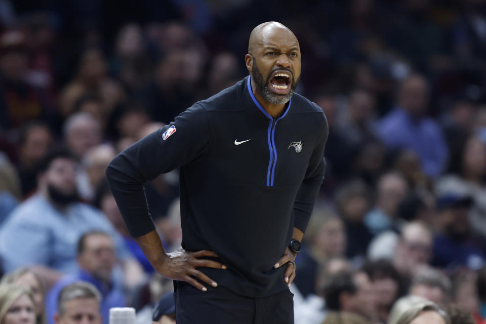 Orlando Magic head coach Jamahl Mosley yells during the first half of a NBA basketball game against the Cleveland Cavaliers, Wednesday, Oct. 26, 2022, in Cleveland. (AP Photo/Ron Schwane)