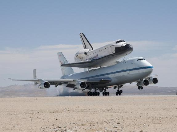 NASA's Shuttle Carrier Aircraft with the space shuttle Endeavour securely mounted on top touches down at Edwards Air Force Base after third leg of its four-segment final ferry flight from the Kennedy Space Center in Florida to Los Angeles Inter