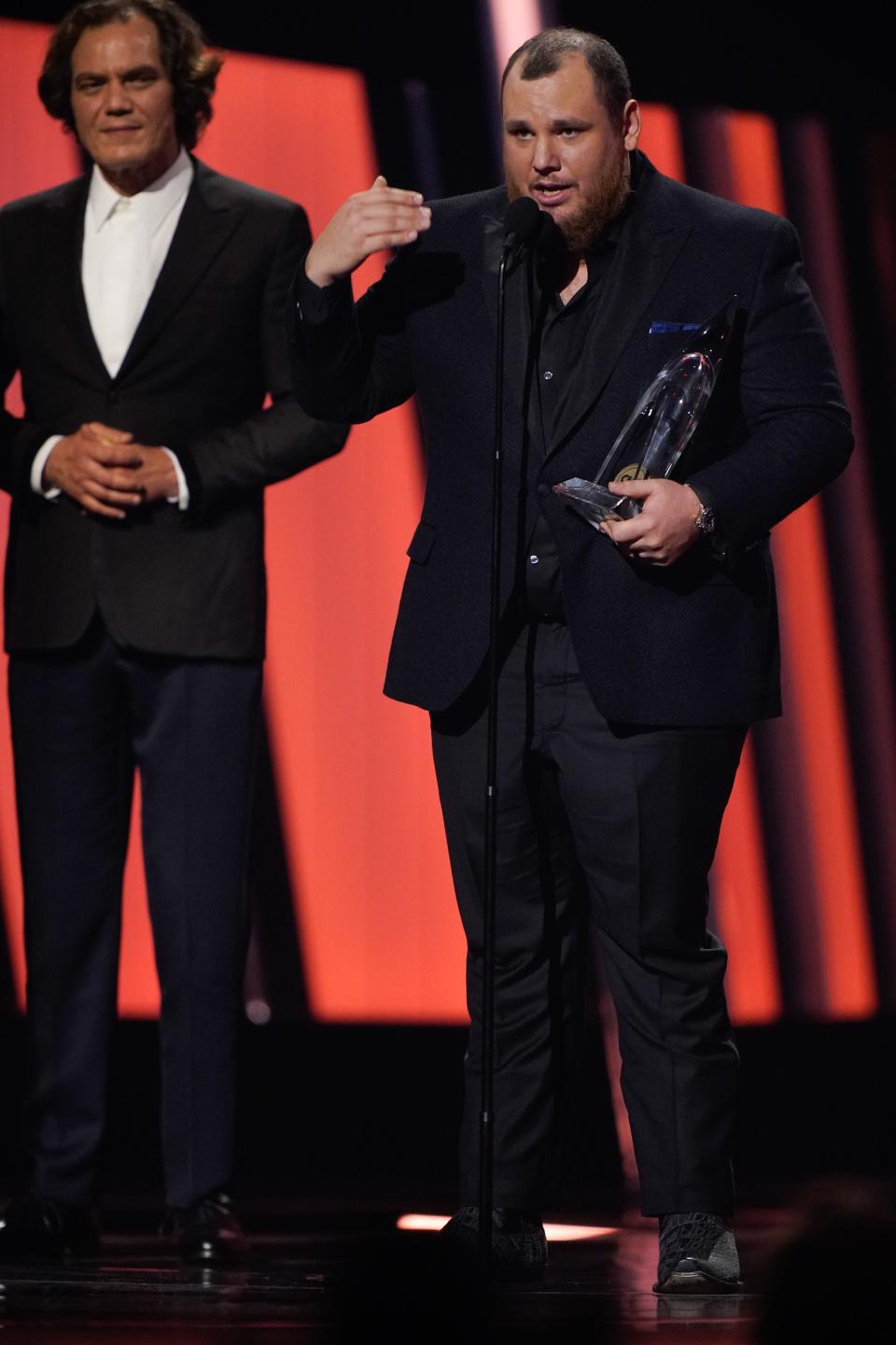 Luke Combs accepts entertainer of the year during the 56th CMA Awards.