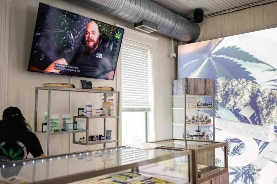 A television monitor inside Crowntown Cannabis shows store owner, Michael Sims, as he hosts his own podcast, Let’s Be Blunt, on Tuesday, April 9, 2024