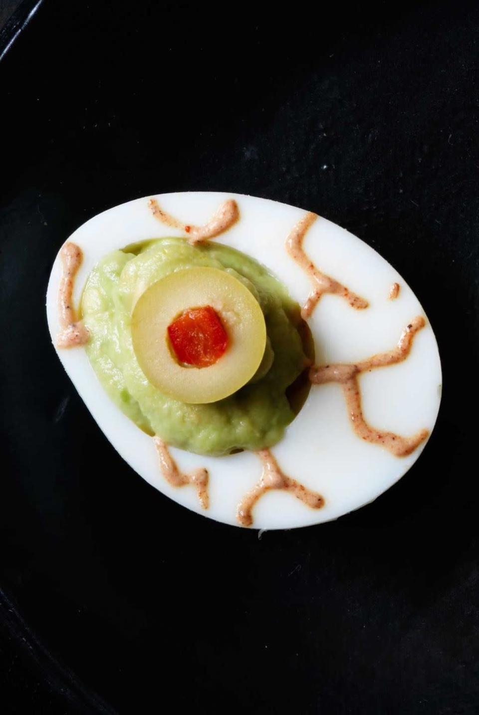 <p>Deviled eggs are a classic potluck recipe option for a party, so why not put a Halloween-y spin on things. You could probably even make these with ingredients you have in your fridge right now.</p><p>Get the <strong><a href="https://www.womansday.com/food-recipes/food-drinks/recipes/a11861/guacamoldy-eyeballs-recipe-123432/" rel="nofollow noopener" target="_blank" data-ylk="slk:Guacamoldy Eyeballs recipe" class="link ">Guacamoldy Eyeballs recipe</a></strong>.</p>