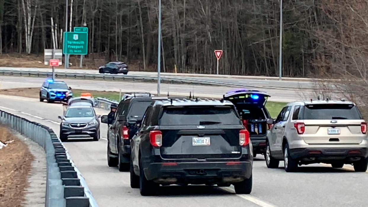 Vehicles are stopped on a highway at a scene where people were injured in a shooting on Interstate 295 in Yarmouth, Maine, Tuesday, April 18, 2023 (AP)