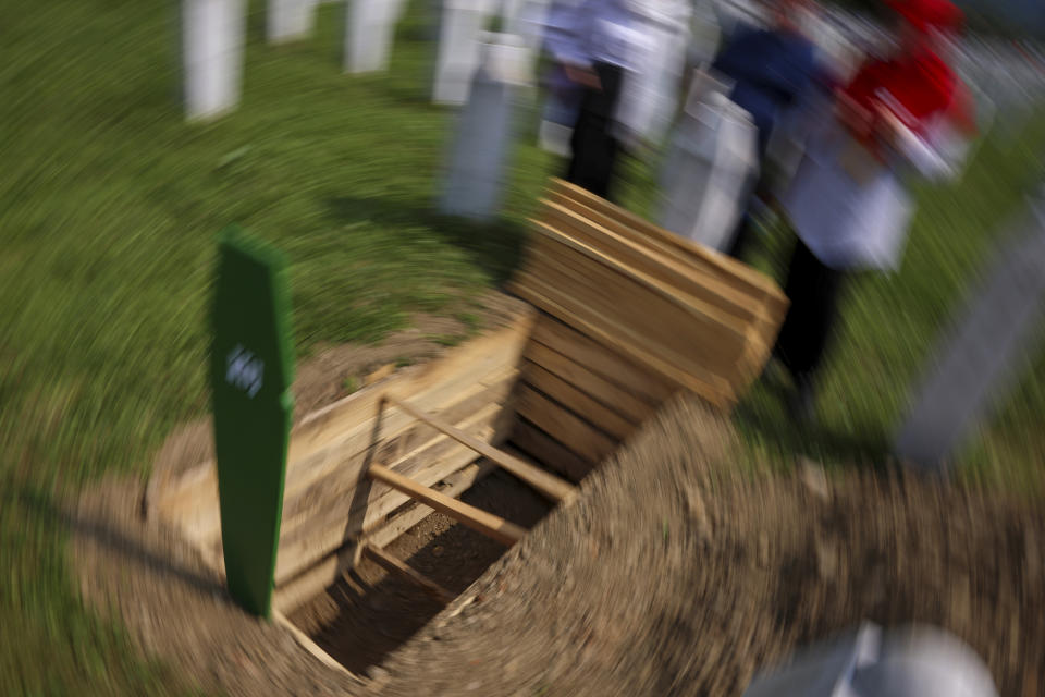 Newly dug grave is seen, prior to the mass burial of newly identified victims of the Srebrenica genocide, in Potocari, Bosnia, Tuesday, July 11, 2023. Thousands converge on the eastern Bosnian town of Srebrenica to commemorate the 28th anniversary on Monday of Europe's only acknowledged genocide since World War II. (AP Photo/Armin Durgut)