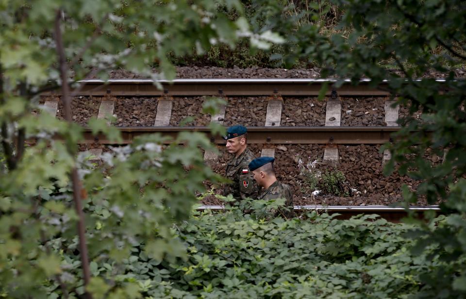 Soldiers from a demining team of the Centre for Training of Military Engineering and Chemical forces from Wroclaw inspect a site (65 km of railway between Wroclaw and Walbrzych) in an area where a Nazi train is believed to be at, in Walbrzych, southwestern Poland September 4, 2015. Poland said on Friday it was almost certain it had located the Nazi train rumored to have gone missing near the close of World War Two loaded with guns and jewels. Polish authorities started looking for the train this month, tipped off by a German and a Pole who said through lawyers that they had found it in the southwestern district of Walbrzych and expected 10 percent of the value of the findings as a reward. REUTERS/Kacper Pempel