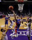 Florida guard Myreon Jones (0) puts up a shot during the first half of an NCAA college basketball game against Kansas State Saturday, Jan. 28, 2023, in Manhattan, Kan. (AP Photo/Charlie Riedel)