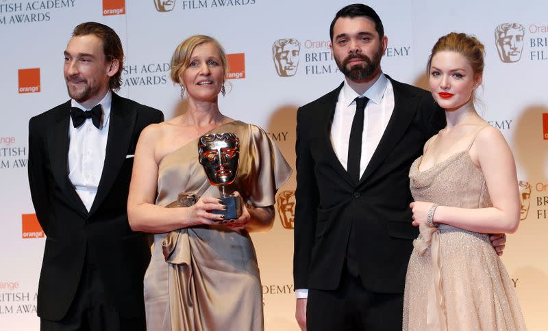 FILE PHOTO: Winners of the Short Animation award for "A Morning Stroll" Orchard and Goffe, pose with presenters Mawle and Grainger at the BAFTA awards ceremony in London