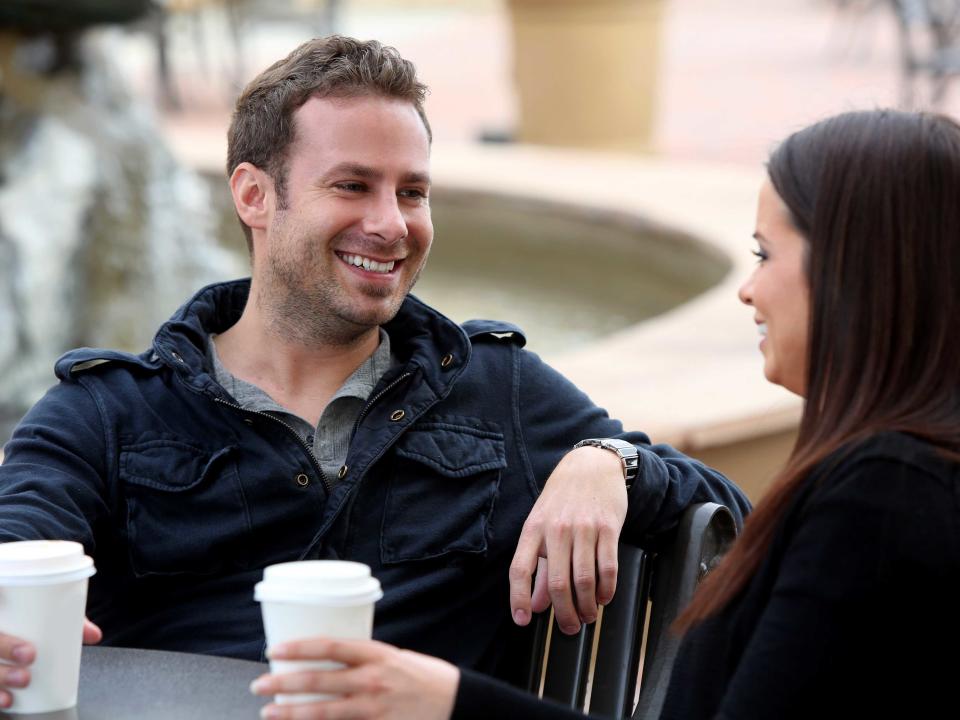 first date couple smiling laughing