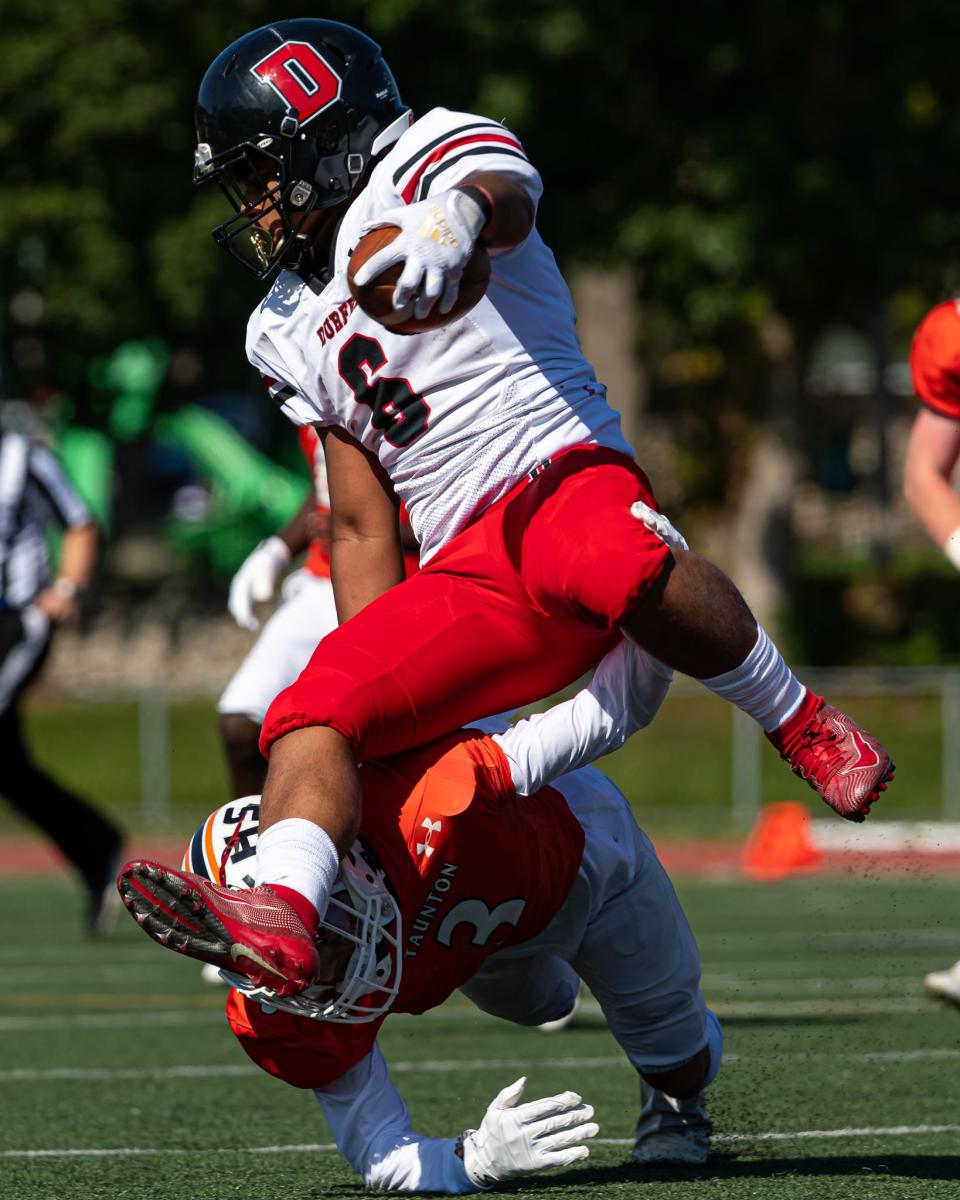 Taunton’s Jose Touron tackles Durfee’s Adrian Romero on Saturday. 