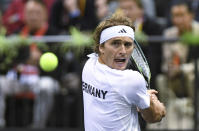 Germany's Alexander Zverev returns to Switzerland's Stan Wawrinka during the Davis Cup, qualifying round tennis match between Germany and Switzerland in Trier, Germany, Friday Feb. 3, 2023. (Harald Tittel/dpa via AP)