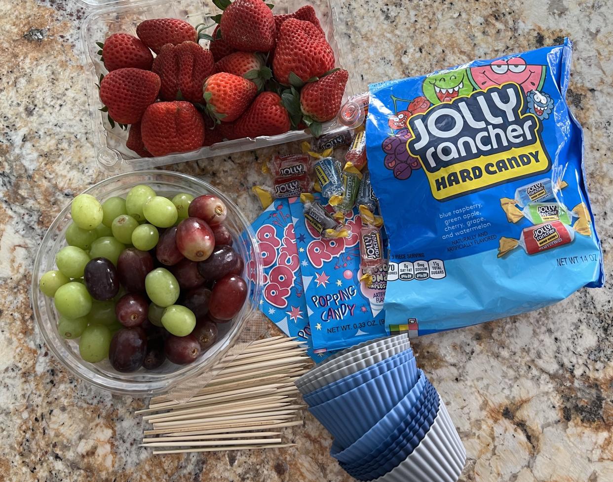 The ingredients for crack grapes: Jolly Rancher candies, Pop Rocks, grapes and strawberries. (Photo: Terri Peters)