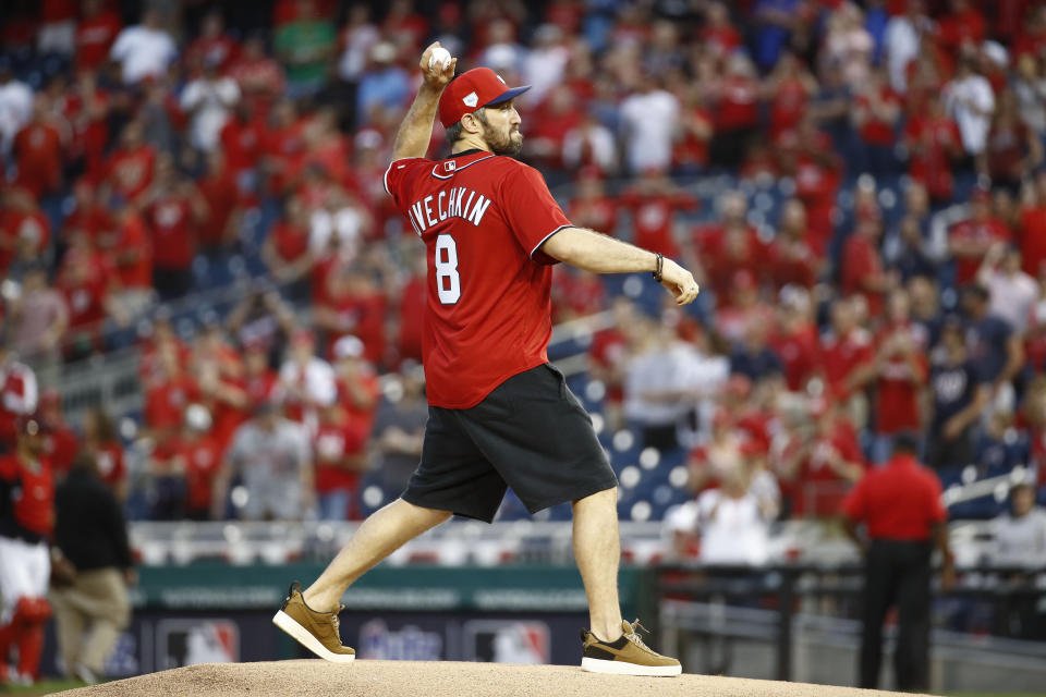 Washington Capitals hockey player Alex Ovechkin throws out a ceremonial first pitch before Game 4 of a baseball National League Division Series between the Los Angeles Dodgers and the Washington Nationals, Monday, Oct. 7, 2019, in Washington. (AP Photo/Patrick Semansky)