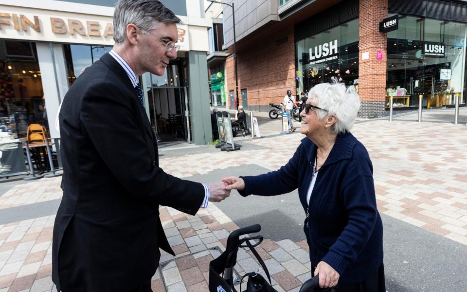 Jacob Rees-Mogg pictured out and about on the campaign trail in Wakefield last week - SWNS