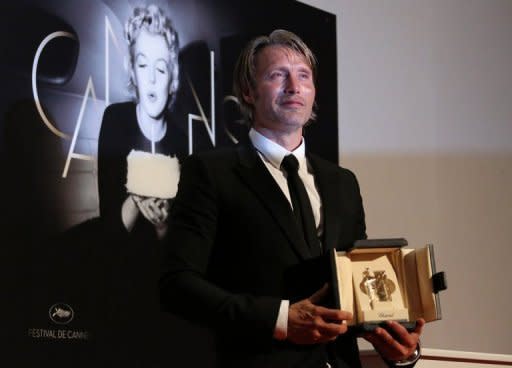 Danish actor Mads Mikkelsen with the Prix d'Interpretation masculine (Best Actor) prize at the 65th Cannes film festival on May 27. He plays a man falsely accused of molesting a child in the psychological thriller "The Hunt" by Thomas Vinterberg