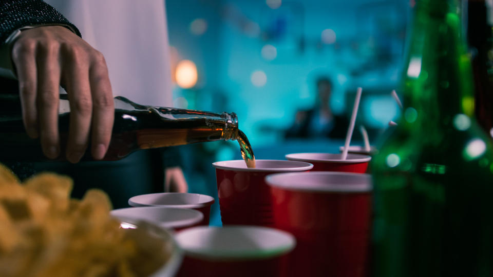 beer being poured into cups