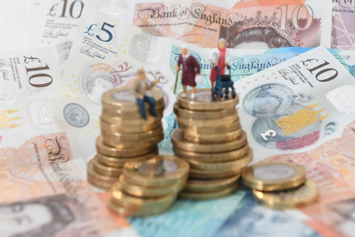 File photo dated 12/09/18 of models of elderly people on a pile of coins and bank notes. The majority of people are still not saving enough for their retirement, a decade on from the introduction of automatic enrolment, according to a committee of MPs. More than 60% of people are at risk of missing out on an adequate standard of living in retirement, the Work and Pensions Committee said. Issue date: Friday September 30, 2022.