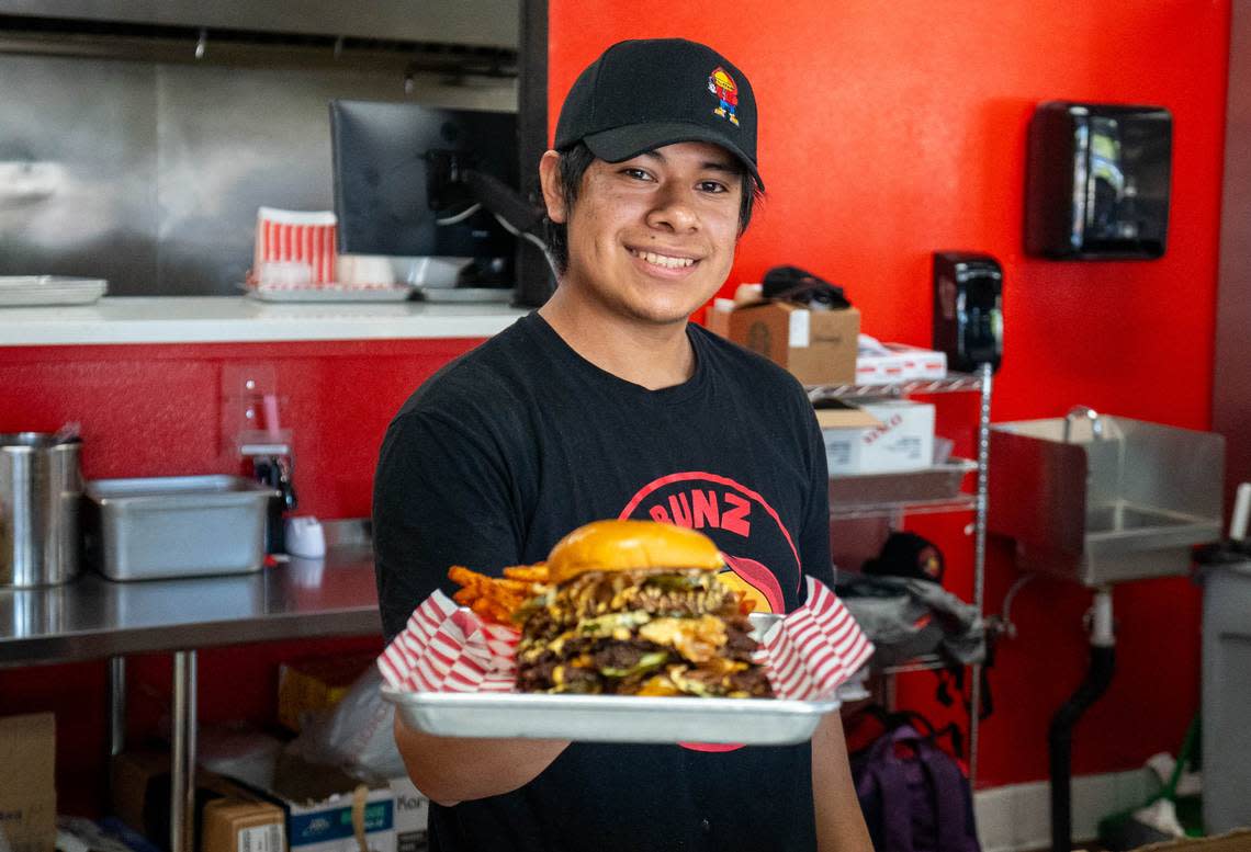 Grill Master Gabriel Marcos serves up the 10x10 Smash Slider at Hot Bunz in Rancho Cordova on Thursday, April 18, 2024.