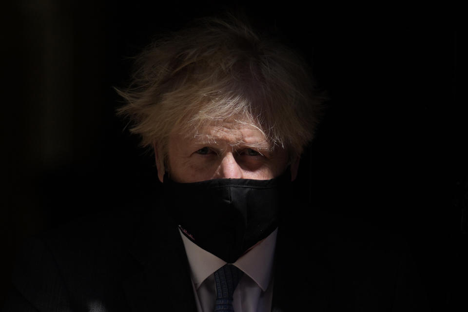 British Prime Minister Boris Johnson leaves 10 Downing Street to attend the weekly Prime Minister's Questions at the Houses of Parliament, in London, Wednesday, June 23, 2021. (AP Photo/Matt Dunham)