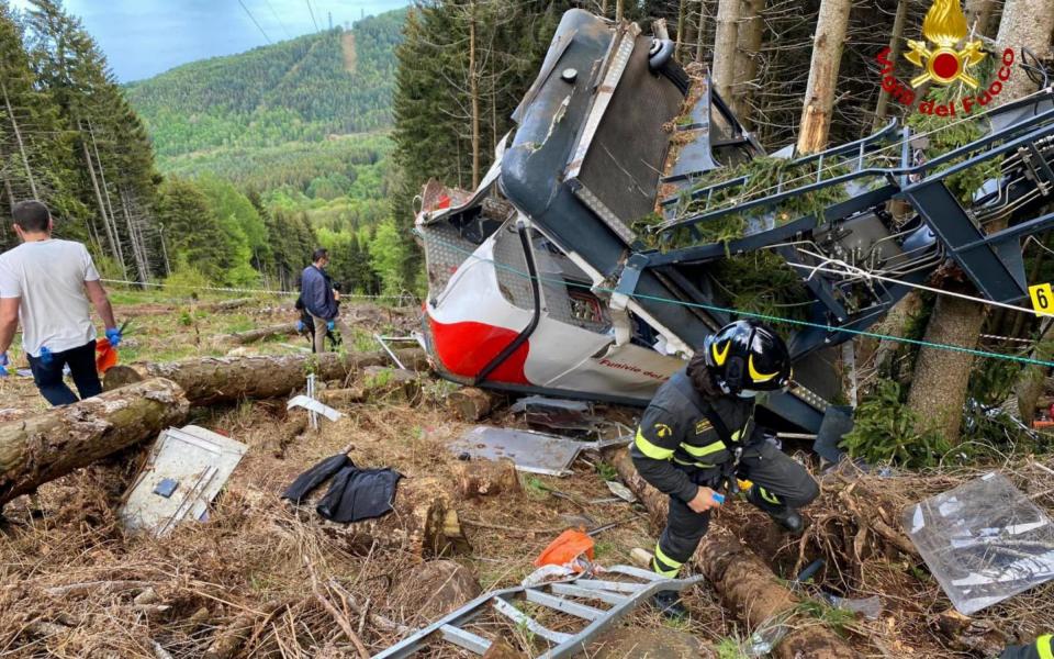 The wreckage of the cable car above Lake Maggiore in northern Italy - EPA