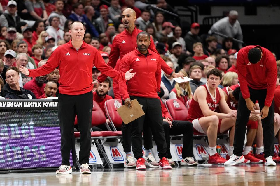 Miami coach Travis Steele and his assistants react to a foul call during a game against Ohio State on Dec. 6, 2023, in Columbus.