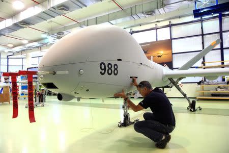 An employee checks an Elbit Systems Ltd. Hermes 900 unmanned aerial vehicle (UAV) at the company's drone factory in Rehovot, Israel, June 28, 2018. REUTERS/Orel Cohen