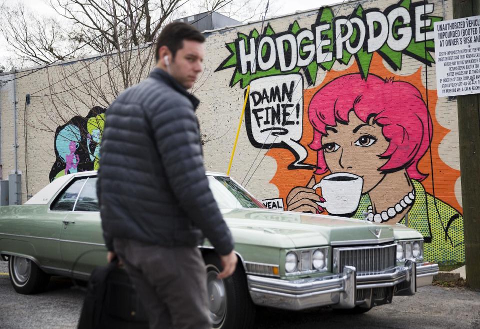 A mural decorates a coffee shop in East Atlanta, Ga., in Dekalb County, Thursday, Jan. 5, 2017. Residents from both urban and rural settings cite significant distinctions between the two major parties' urban and small-town anchors. Still, they suggest that perceptions and stereotypes exaggerate the realities of Trump's two Americas. (AP Photo/David Goldman)