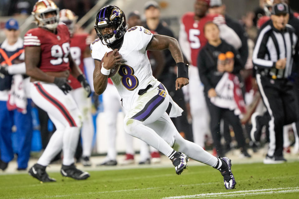 Lamar Jackson beat Brock Purdy and the 49ers on Monday, and now has a chance to effectively cement himself as NFL MVP by beating the Dolphins this weekend and locking up the No. 1 seed in the AFC for the Ravens. (Photo by Thearon W. Henderson/Getty Images)