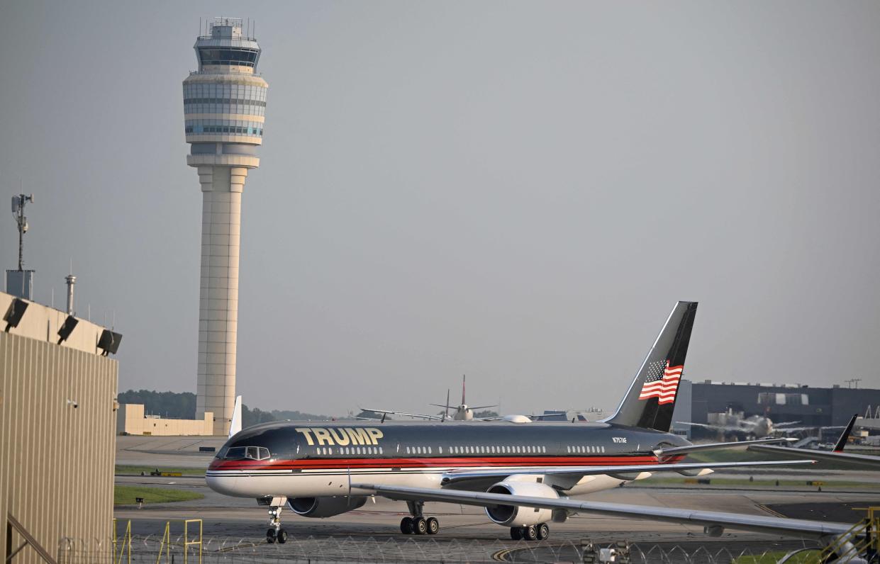 Trump Force One with former US President Donald Trump on board arrives at Atlanta Hartsfield-Jackson International Airport on 24 August 2023 (AFP via Getty Images)