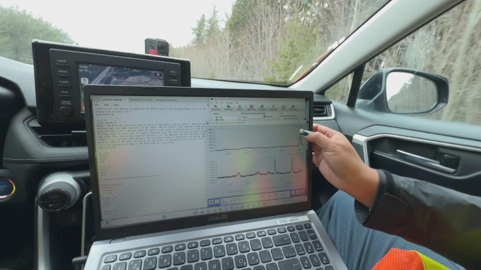 Nadia Tarakki puts her thumb on her laptop screen, registering a plume of methane as the vehicle passes a spot where methane is leaking. 