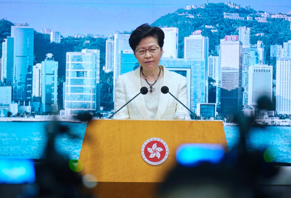 Hong Kong Chief Executive Carrie Lam listens to questions during a news conference in Hong Kong, Tuesday, May 11, 2021. Lam announced Hong Kong officials have dropped a plan to make it mandatory for foreign domestic workers to be vaccinated against the coronavirus, after the move drew criticism that it was discriminatory. (AP Photo/Vincent Yu)