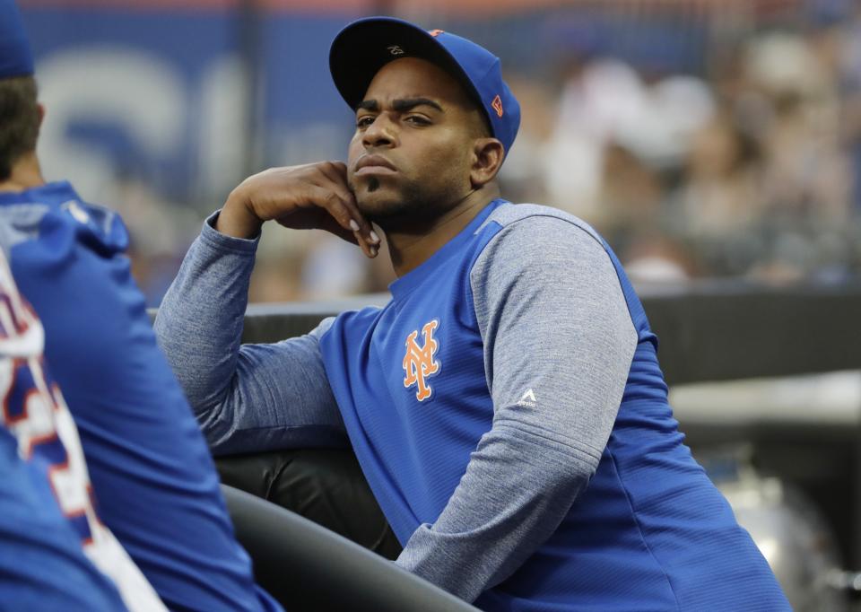 New York Mets' Yoenis Cespedes watches his team play the San Diego Padres during the first inning of a baseball game Tuesday, July 24, 2018, in New York. (AP Photo/Frank Franklin II)