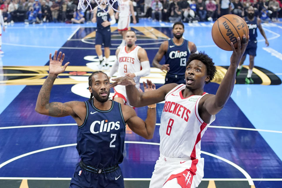 Houston Rockets forward Jae'Sean Tate, right, shoots as Los Angeles Clippers forward Kawhi Leonard defends during the first half of an NBA basketball In-Season Tournament game Friday, Nov. 17, 2023, in Los Angeles. (AP Photo/Mark J. Terrill)