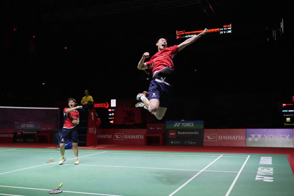 China's Feng Yan Zhe, right, and Huang Dong Ping celebrate after defeating China's Jiang Zhen Bang and Wei Ya Xin during their mixed doubles final match in the Indonesia Masters badminton tournament in Jakarta, Indonesia, Sunday, Jan. 29, 2023. (AP Photo/Achmad Ibrahim)