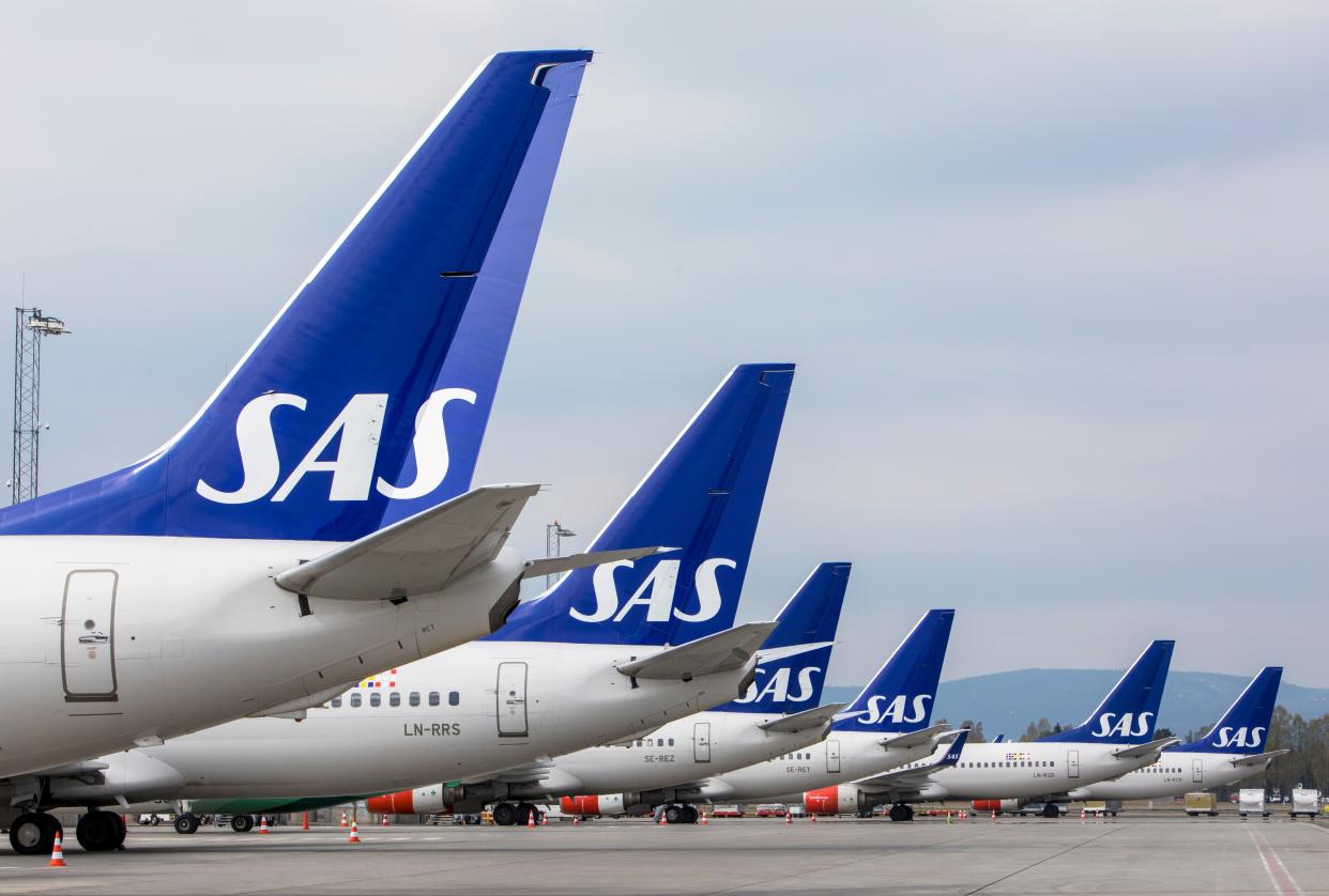 FILE - SAS planes are grounded at Oslo Gardermoen airport during pilots strikes, in Oslo, Friday, April 26, 2019.