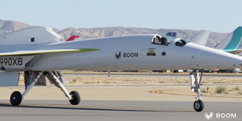 A pilot sitting in the cockpit of the Boom Supersonic experimental aircraft.