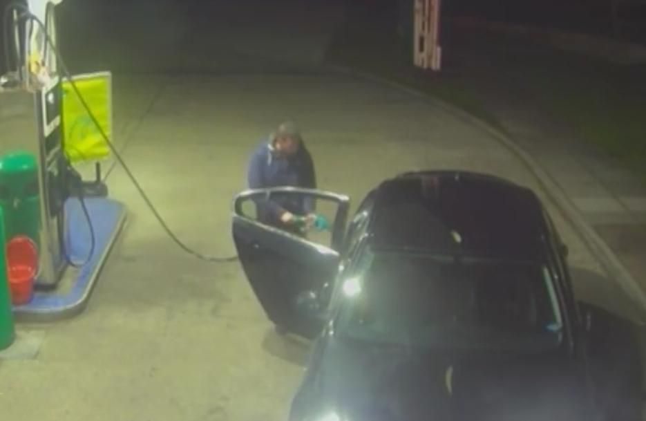 Hearne is pictured pumping petrol into the back seat (Picture: Kent Police)