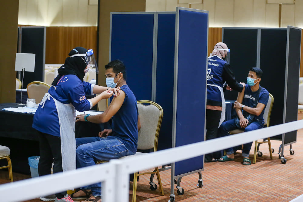 Manufacturing workers in Selangor receive their Pikas Covid-19 jab at the vaccination centre at Setia City Convention Centre in Shah Alam June 28, 2021. — Picture by Yusof Mat Isa