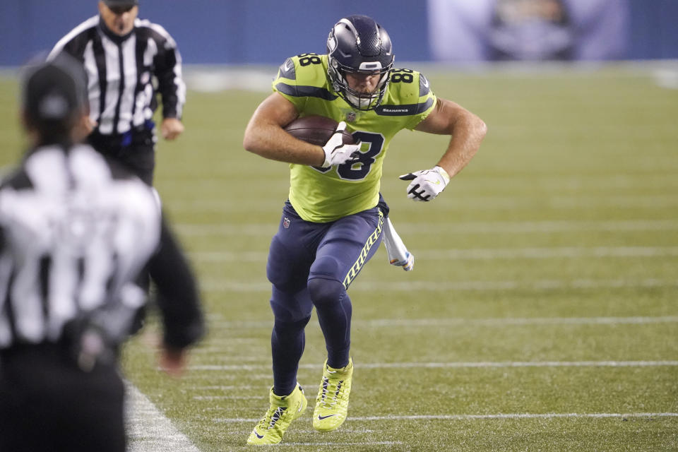 Seattle Seahawks tight end Greg Olsen runs with the ball against the Minnesota Vikings during the second half of an NFL football game, Sunday, Oct. 11, 2020, in Seattle. (AP Photo/Ted S. Warren)