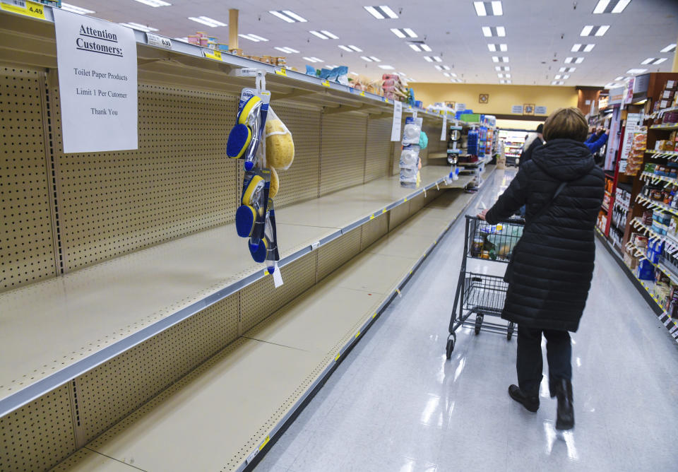 Rosauers customers found the shelves empty of toilet paper during senior and at-risk shopping at the grocery store on 29th Avenue, Thursday, March 19, 2020, in Spokane, Wash. (Dan Pelle/The Spokesman-Review via AP)